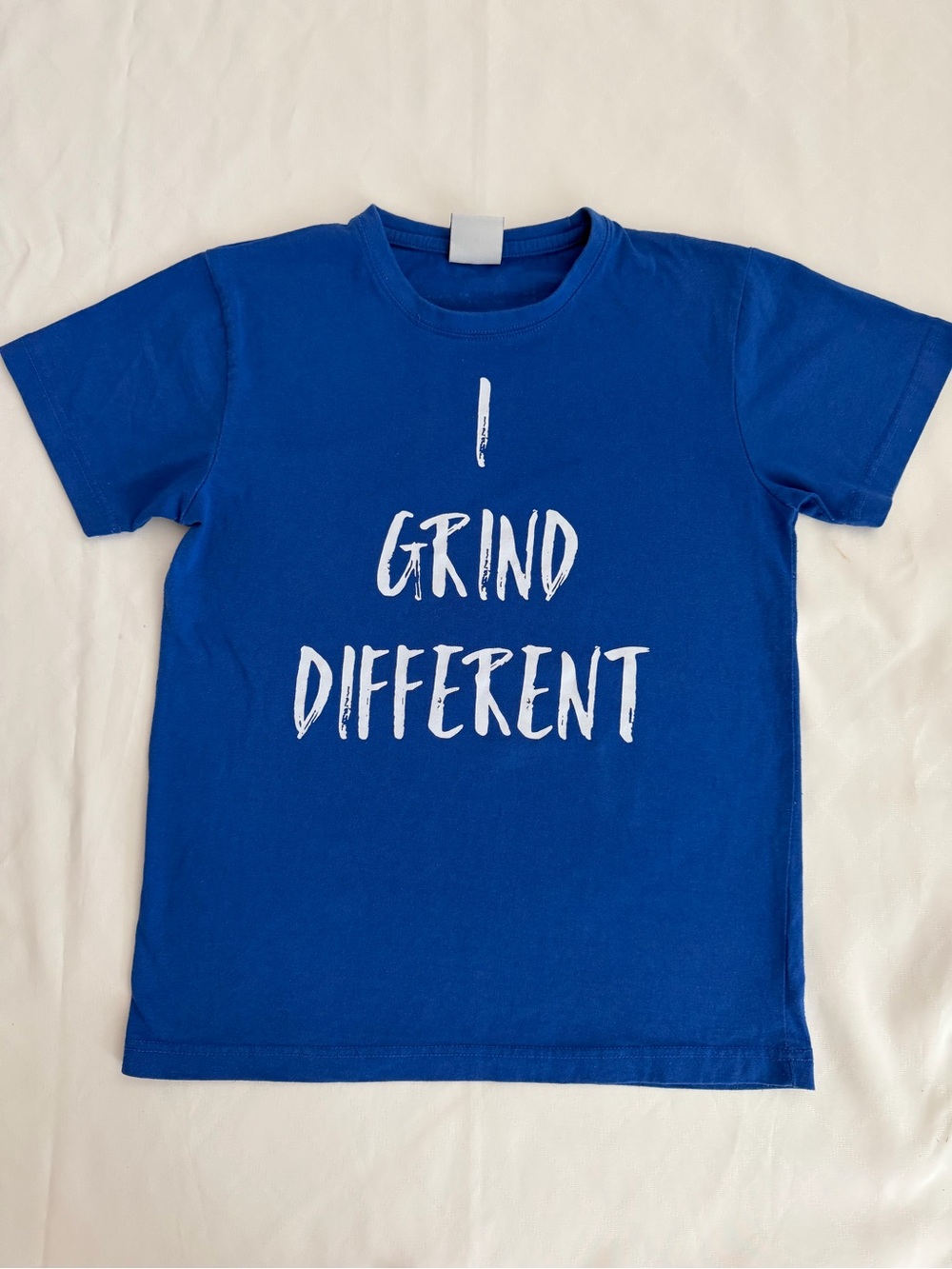 NG Royal Blue Graphic Women Tee with White 'I Grind Different' Text sz M. T023